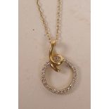 A 14ct yellow gold and diamond set halo style pendant necklace