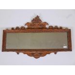 A C19th satin walnut landscape overmantel mirror, with carved and pierced crest, 36" x 24"