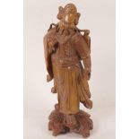 A Chinese carved hardwood figure of a sage with bone and glass eyes, 12" high