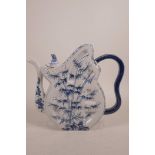 An Oriental blue and white porcelain teapot, 9" high