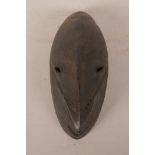 A New Guinea carved wood Sepik tribal mask, 9½" long x 4" wide
