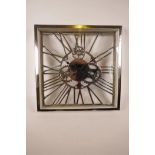 A chrome plated wall clock cast in skeleton form, quartz movement, 14" square