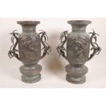 A pair of Japanese vases with palm tree handles and applied decoration of cranes, 12" high
