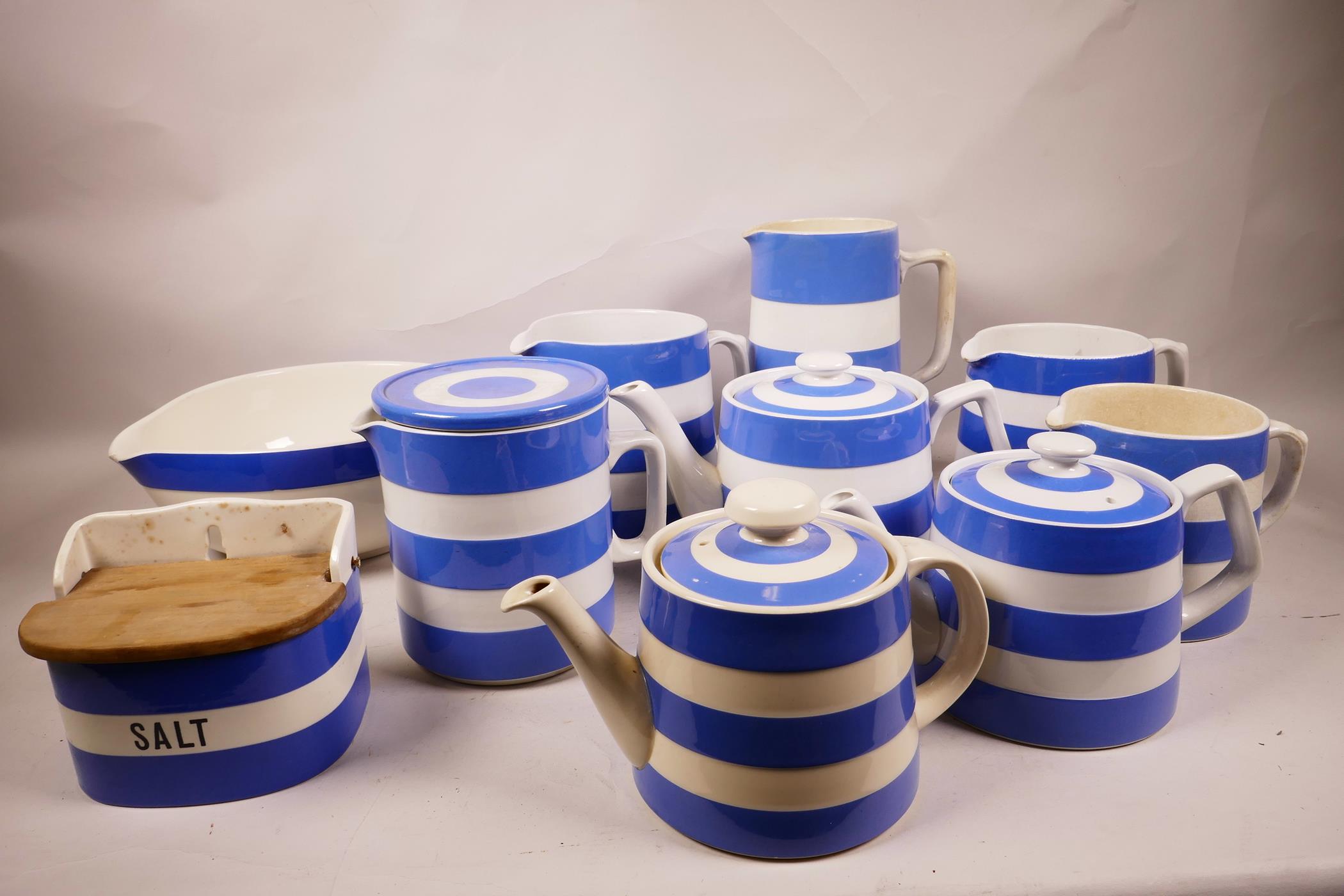 Ten large pieces of T.G. Green and Co. Cornish ware, blue and white, including three teapots, a