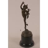 A small bronze figurine of Mercury mounted on a turned pedestal base, 8" high