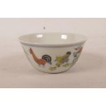 A Chinese doucai porcelain tea bowl with chicken decoration, 6 character mark to base, 3" diameter