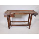 A beech carpenter's work bench with two vices, A/F, worm treated, 48" x 17½", 30½" high
