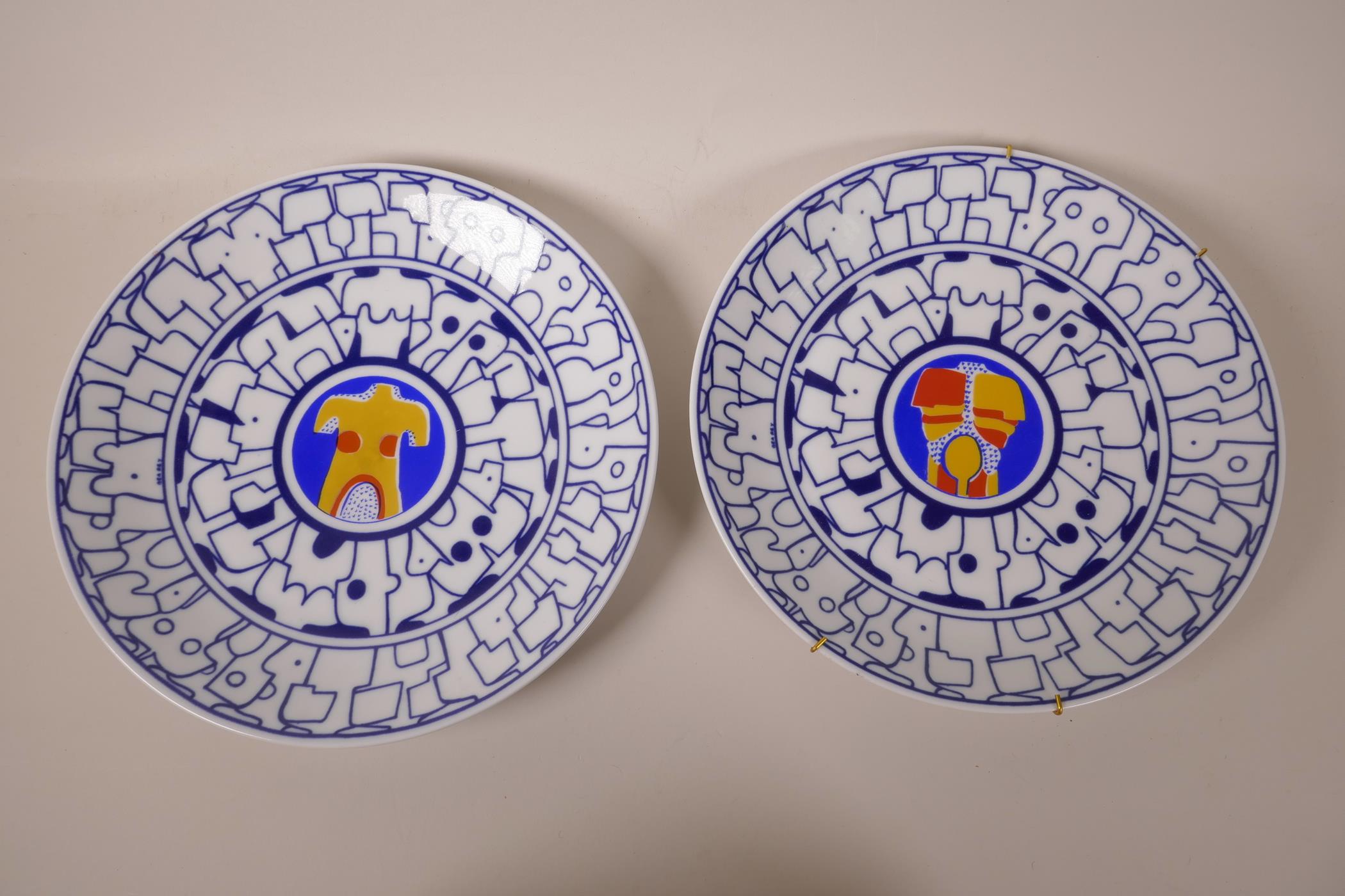 A pair of Spanish Ceramicas de Castro limited edition 'Adam and Eve' porcelain wall plates,
