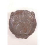 A bronze ashtray cast as a dog's head, 4½" diameter