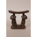An African carved wood luba head rest with figural decoration, 6" high
