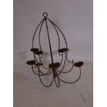 A cast iron ten branch chandelier, A/F missing one sconce, 34" drop