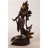 A bronze figure of Shiva, inset with coloured beads, 11" high