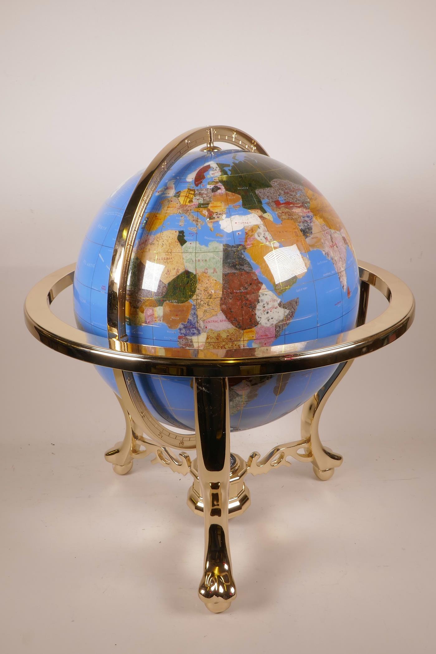 A composition and specimen stone terrestrial globe, 19½" high