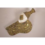 A large Sino-Tibetan brass conch shell with raised animal and floral decoration, 17" long