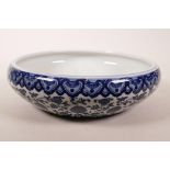 A Chinese blue and white bowl with lotus flower decoration, seal mark to base, 11" diameter
