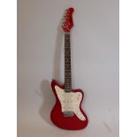 A 'Gear4Music' ruby red electric guitar with a pearlescent fingerplate, 40" long