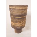 An unglazed studio pottery vase of footed cylindrical form, with ribbed decoration, 7¼" high