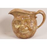 A stoneware face jug in the style of Martin Brothers, 7" high