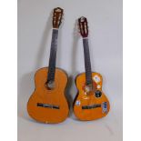 An acoustic guitar, together with an Encore three quarter length acoustic guitar and case, largest