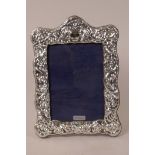 A silver photograph frame, hallmarked 2018, aperture 4" x 5½"