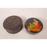 A Russian lacquer pill box, the lid decorated with a girl choosing her jewellery, 2½" diameter,