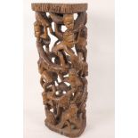 An African hardwood lamp base carved as a tower of figures, 18½" high