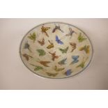 A Chinese porcelain rice bowl decorated with butterflies, 7" diameter