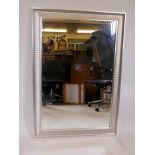 A large silvered composition overmantel mirror, 35½" x 51"