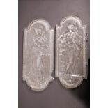 A pair of French moulded glass plaques, decorated with maidens bearing ewers (faults), 16" long