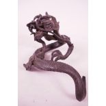 A C19th Oriental bronze dragon, finely cast, possibly detached from a vase, 9" long x 5" wide,