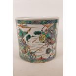 A Chinese famille verte porcelain brush pot with decorative panels depicting battle scenes, 6