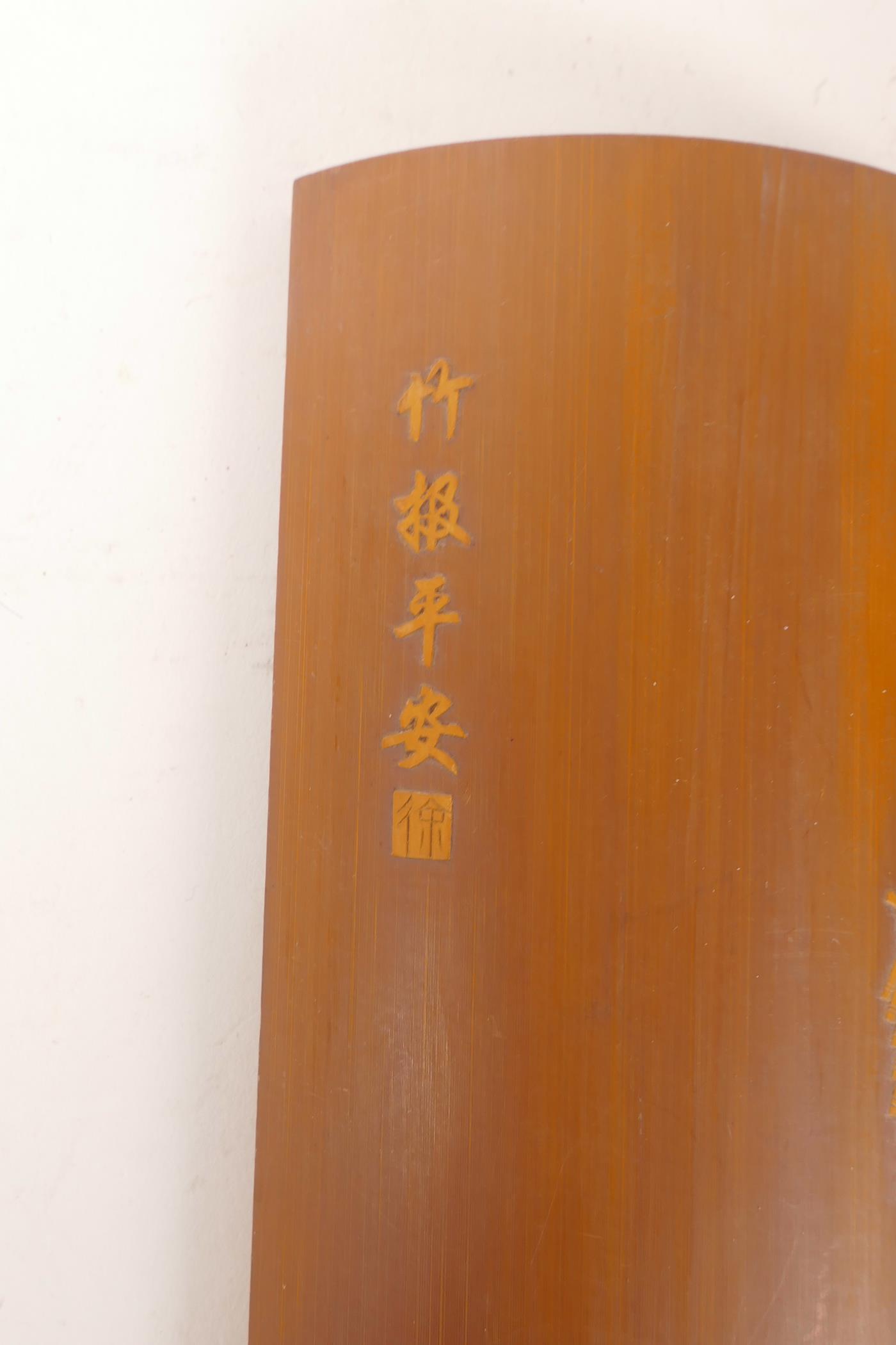 A Chinese carved bamboo wrist rest decorated with boys playing with fireworks, 12" long - Image 2 of 3