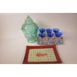 A Chinese blue glass and embossed metal set of glasses on a pierced and embossed tray, 12½" x 8",