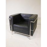 A Cassava style leatherette and chrome armchair, 27" high, 35" wide