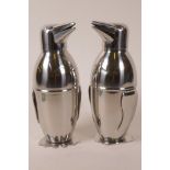 A pair of silver plated cocktail shakers in the form of penguins, 8½" high