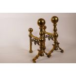 A pair of C19th brass andirons, 12" x 8"