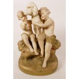 An early C20th Royal Dux Bohemia porcelain figurine of two cherubic children hugging their dog,