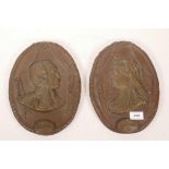 A pair of cast oval plaques with raised profiles of Victoria and Albert, 11" high