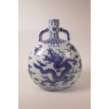 A large Chinese blue and white pottery two handled moon flask with dragon decoration, 6 character