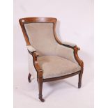 A Victorian inlaid walnut nursing chair raised on square tapering supports