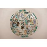 A Chinese famille verte porcelain charger decorated with a hunting scene, 6 character mark to