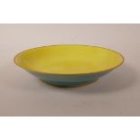 A Chinese porcelain dish with a yellow ground bowl and sea green glazed exterior, 6 character mark