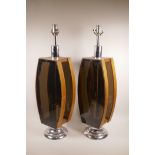A pair of mid century teak and smoked perspex lamps, 29½" high
