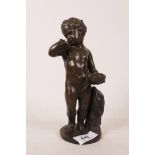 A bronze figure of a child bearing a bowl of fruit, 8" high