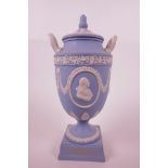 A Wedgwood blue Jasperware two handled urn and cover on stemmed support, inscription 'West End
