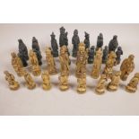 A composition chess set moulded as Chinese figures, kings 4½" high
