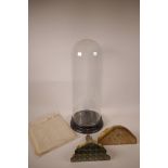 A glass dome and stand (please note the dome does not fit well on the stand), 22" long x 7"