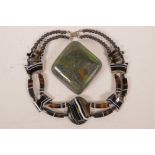 A banded agate necklace, together with a sugar treated opal stone