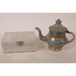 An Eastern painted ceramic teapot with metal handle, spout and banded decoration, 6" high,