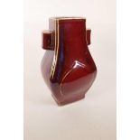 A Chinese flambé glazed pottery vase with two lug handles, inscribed mark to base, 12" high